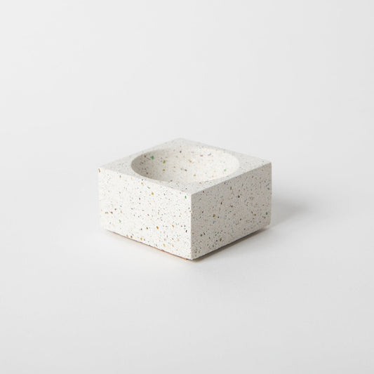Square concrete terrazzo incense holder in white.