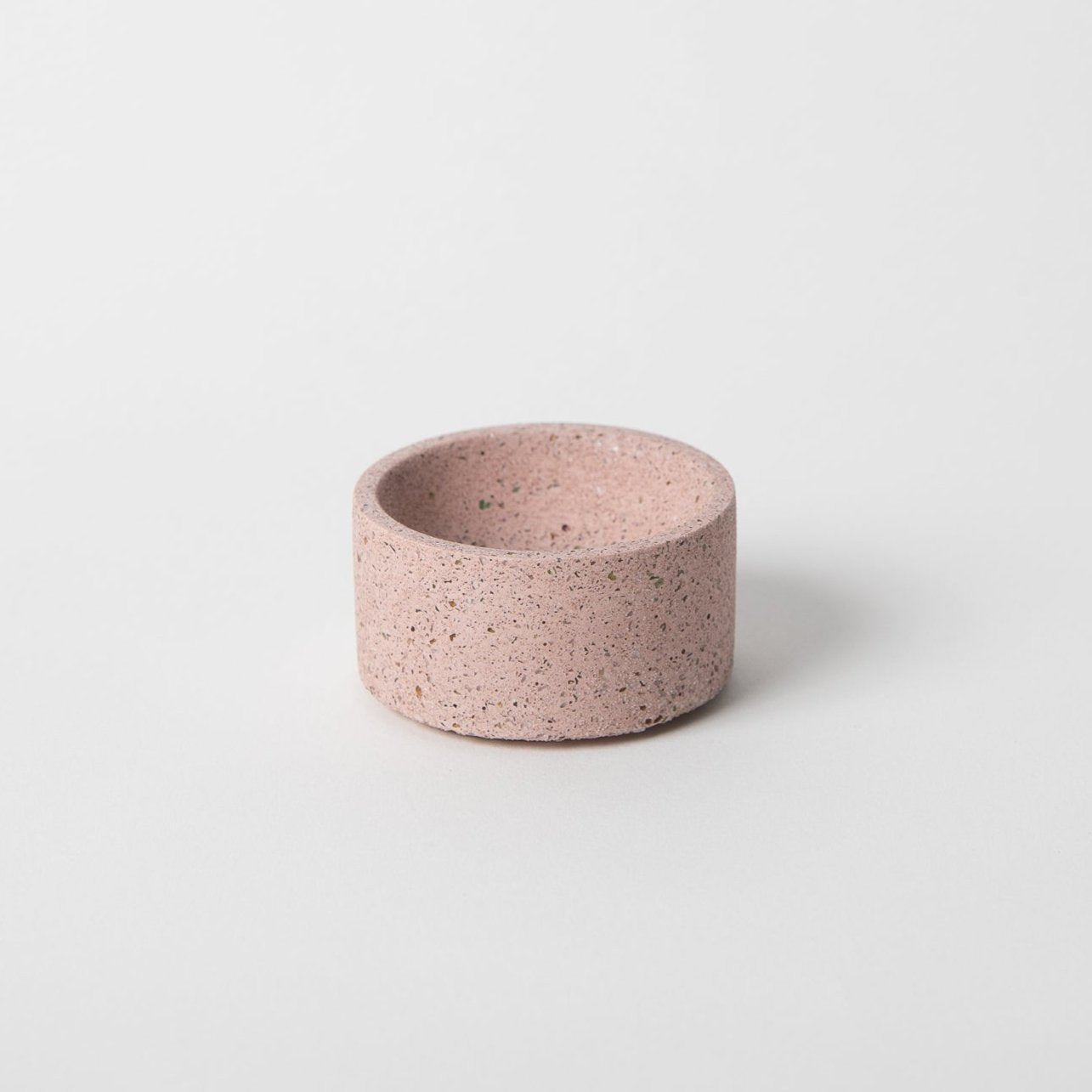 Round terrazzo concrete incense holder in natural.