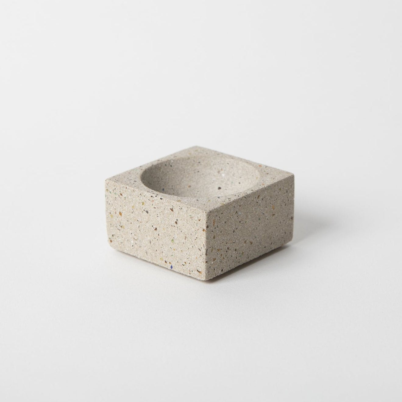 Square concrete terrazzo incense holder in natural.